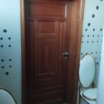 Panelled hardwood door with moulded detail in a finished interior