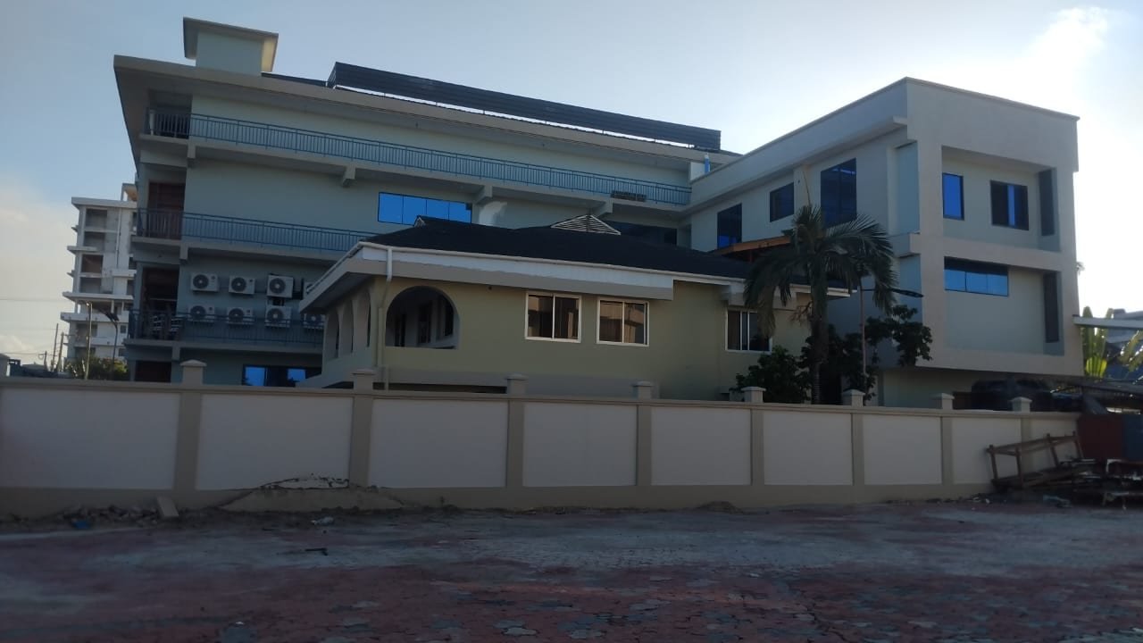 Exterior of a completed Dar es Salaam building showing external works