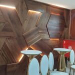Backlit hexagonal timber feature wall built by Simba Umeme in a Dar es Salaam event lounge