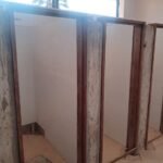 Timber-framed washroom partitions installed by Simba Umeme on an institutional project