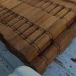 Stack of turned hardwood balusters ready for finishing