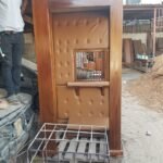 Solid hardwood confessional box with upholstered lining, built by Simba Umeme Engineering